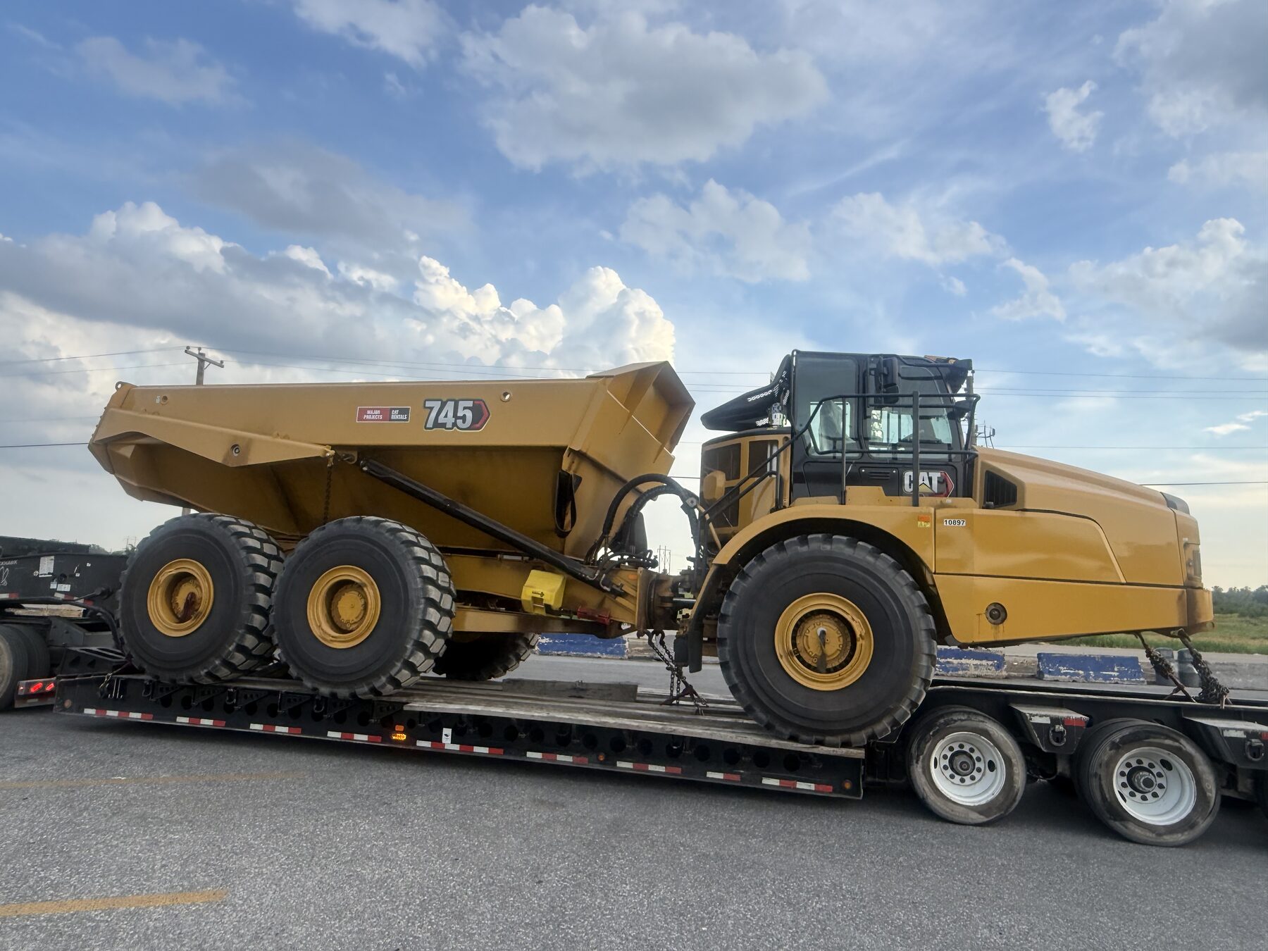 CAT 745 articulated dump truck heavy haul on lowboy trailer