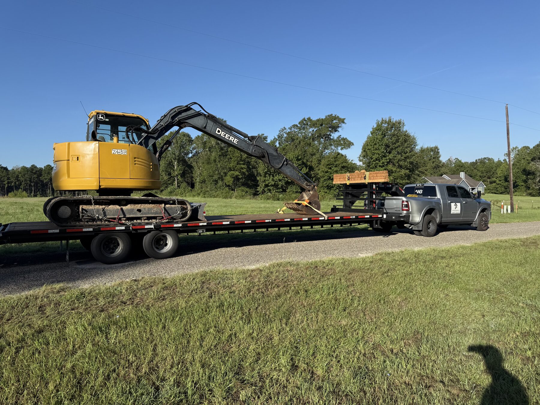John Deere excavator hauled on a hotshot trailer