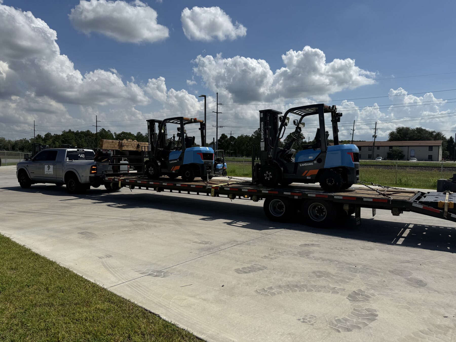 LiuGong forklifts loaded on a step deck trailer